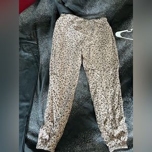 From buckle, great condition. Floral woven joggers khaki in color, black flowers